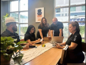 NTOE team gathering around a table.